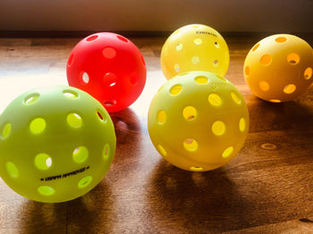 Indoor vs. Outdoor Pickleball Balls: Choosing the Right Ball for Your Game - RacquetGuys.ca