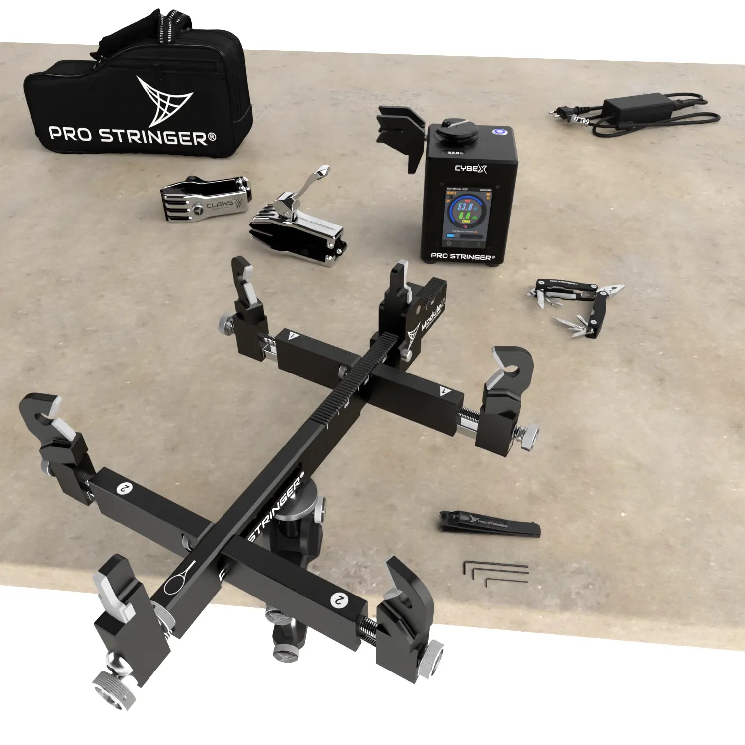 Tennis racquet stringing equipment set with Pro Stringer branded tools on a wooden surface
