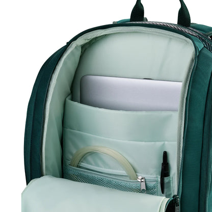 Green backpack with compartments and a laptop inside on a white background